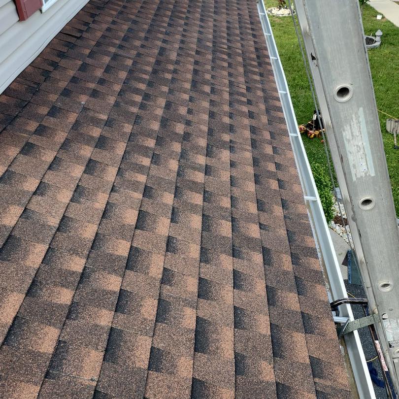 Gray shingle roof installation